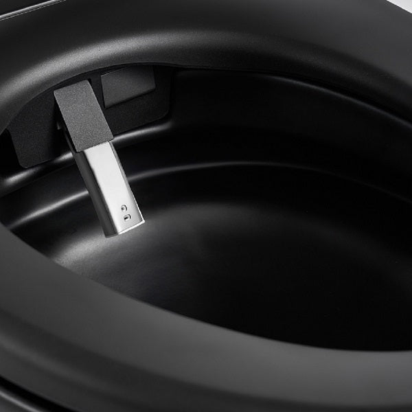 Self-cleaning bidet nozzle extended from Milano matte black smart toilet