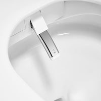 Annecy smart toilet with open lid showing ceramic bowl and self-cleaning bidet nozzle