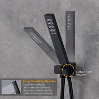 Black shower head with flexible hose on a gray concrete wall