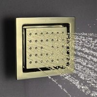 Cascada square body jet brushed gold angled close-up – warm finish nozzle detail