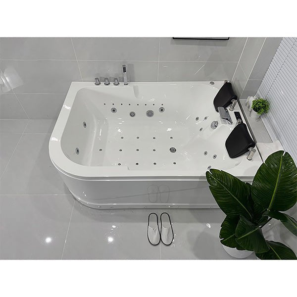 White corner bathtub with jets in a bathroom setting, Cascada Amalfi white acrylic two-person freestanding jacuzzi bathtub