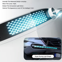 Close-up of a car's LED light with text about advanced design language and luxury style.