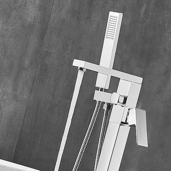 Chrome shower set with handheld shower head and control handle on a gray tiled wall background