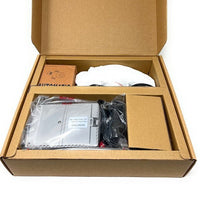 Open cardboard box containing electronic components and packaging of EcoMotion sensor faucet