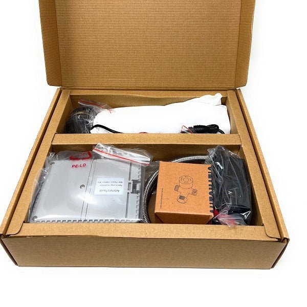 Open cardboard box containing electronic components and packaging 