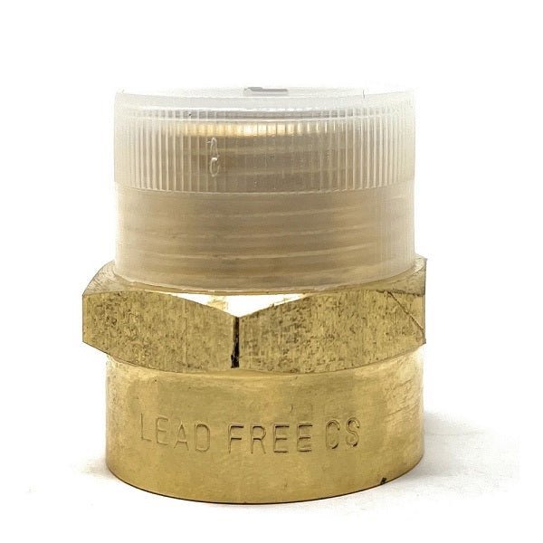 Brass plumbing fitting with a clear cap on a white background