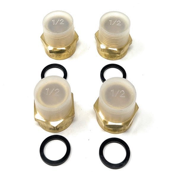 Four brass pipe fittings with translucent white plastic caps marked '1/2', BSPP to NPT brass fitting adapter with washer for water filtration systems